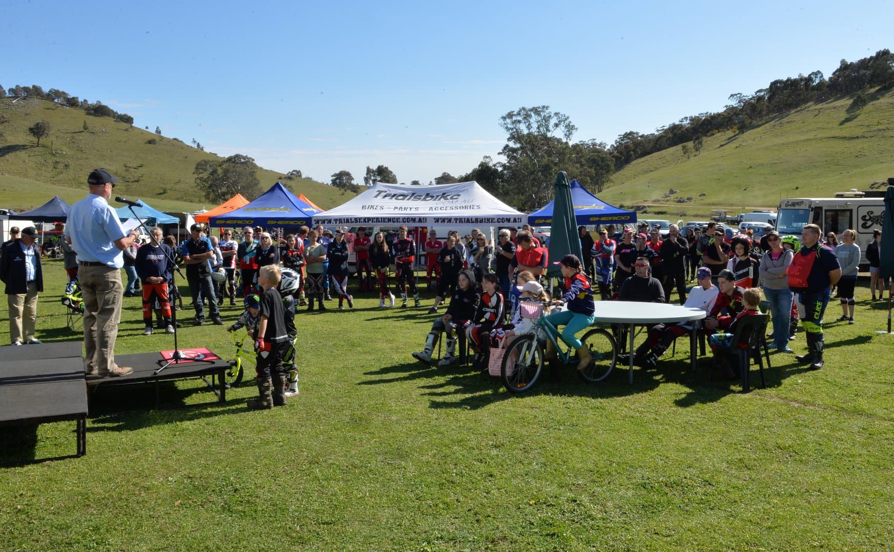 Riders and spectators gathering at an Australian motorcycle trials event