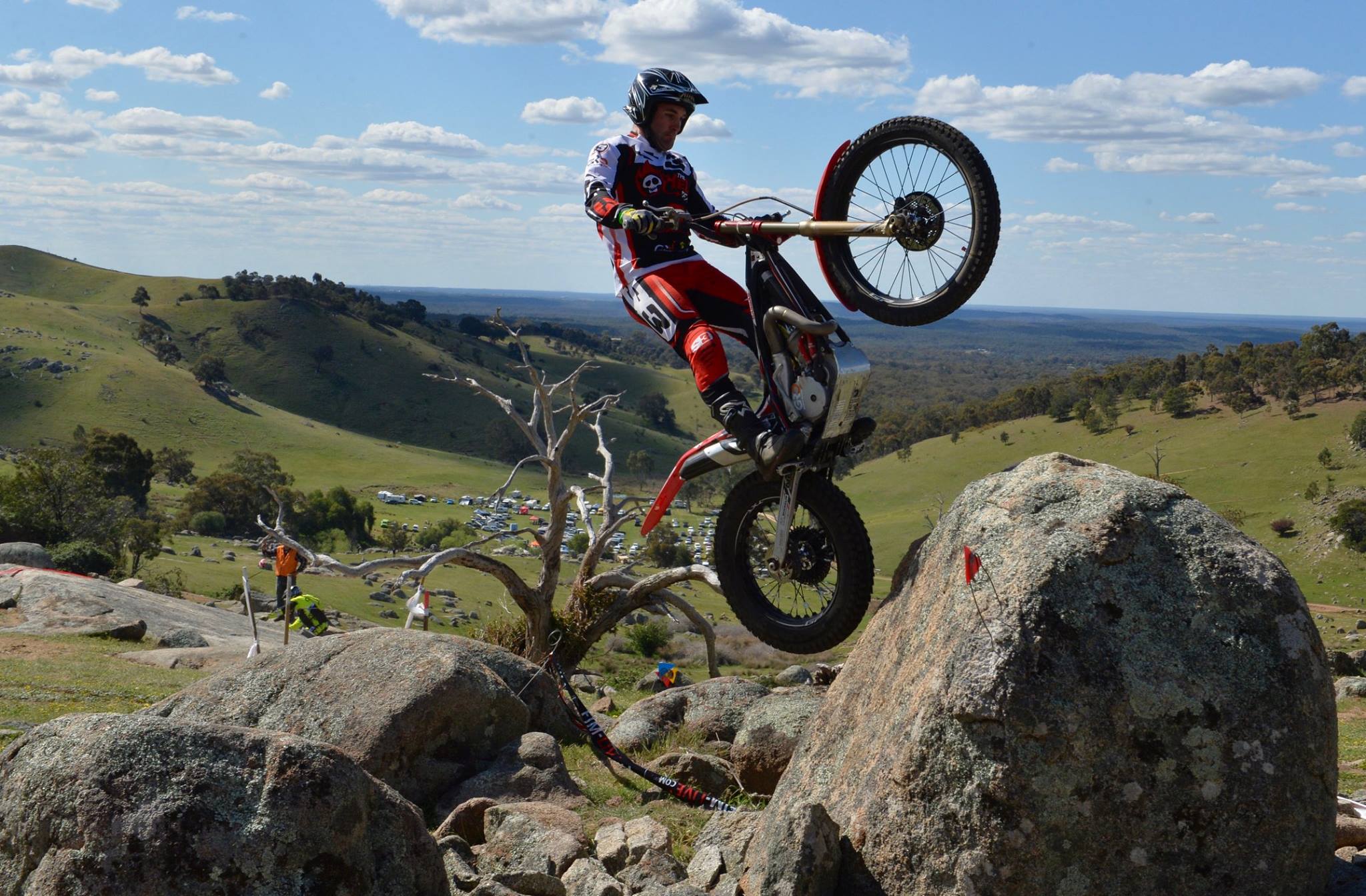 Trials rider navigating rocky terrain